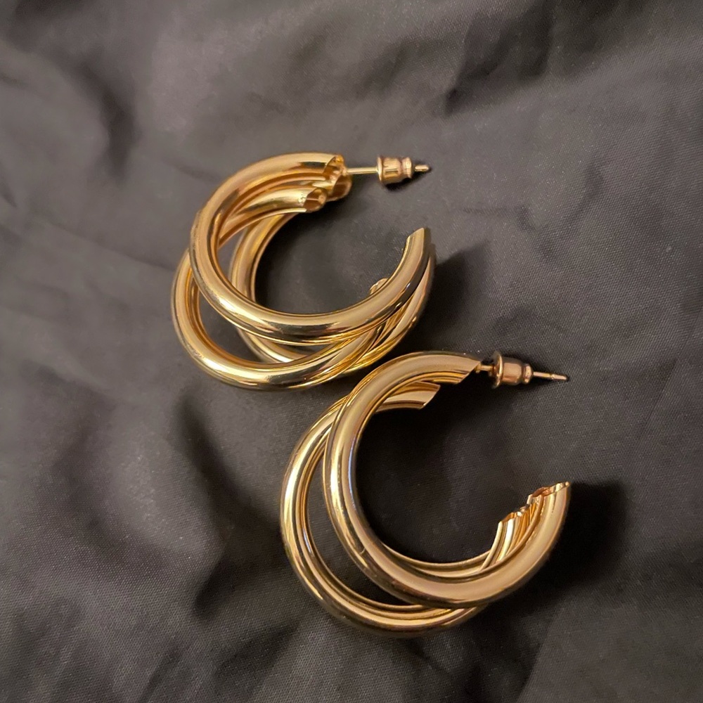 Gold colored hoop earrings. New